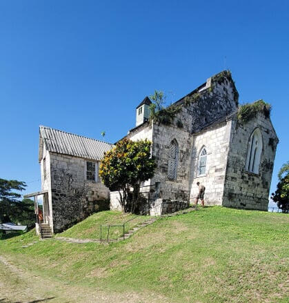 Old church building on a grassy hill